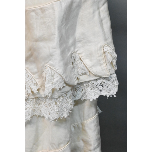 1298 - An early 20th century lined Christening robe, with lace and silk edgings 