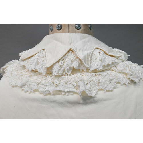 1298 - An early 20th century lined Christening robe, with lace and silk edgings 