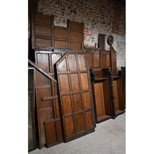 830 - A large quantity of oak wall panels, components, door and parts for large wardrobe/cupboard, as remo... 