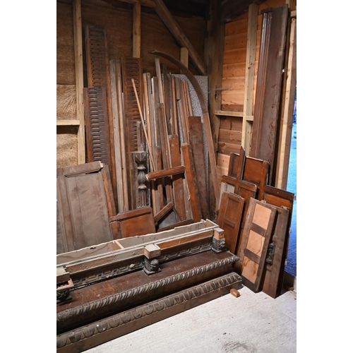 830 - A large quantity of oak wall panels, components, door and parts for large wardrobe/cupboard, as remo... 