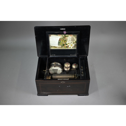 975A - A 19th Century Swiss musical box with clockwork movent, playing eight airs on a comb, three bells an... 