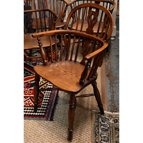 931 - Four 19th century well-matched harlequin yew and elm low splat-back Windsor armchairs with crinoline... 