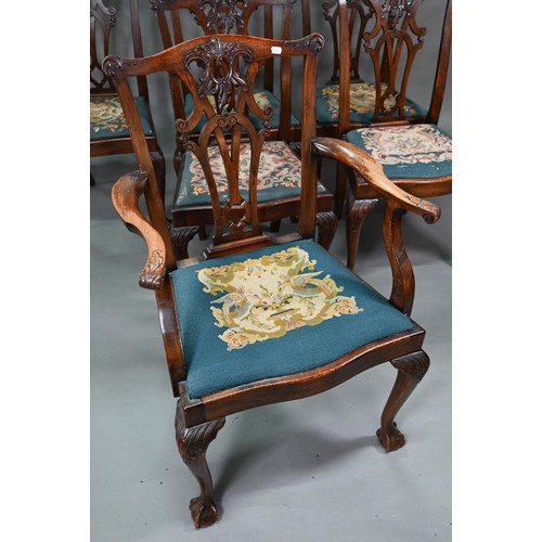 859A - A set of mahogany Chippendale-style dining chairs with ball and claw feet and sabre back legs, with ... 