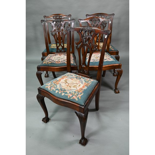 859A - A set of mahogany Chippendale-style dining chairs with ball and claw feet and sabre back legs, with ... 