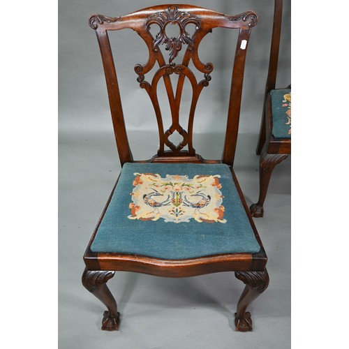 859A - A set of mahogany Chippendale-style dining chairs with ball and claw feet and sabre back legs, with ... 