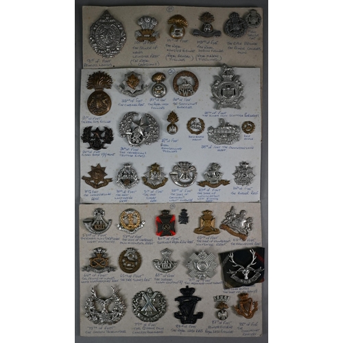 1048 - Approx 60 card-mounted Victorian and later British Military Infantry cap badges, a quantity of vario... 