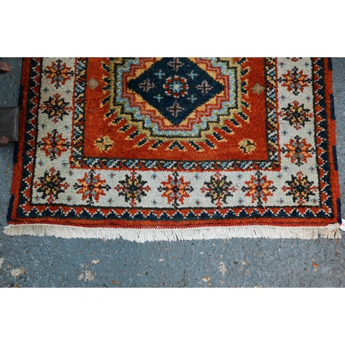 1218 - A contemporary Indo-Persian Kazak runner, burnt orange ground with five alternating lozenge design, ... 