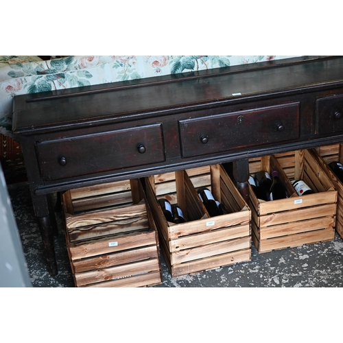 901 - An 18th century oak three drawer low dresser, very dark surface finish, raised on three turned front... 