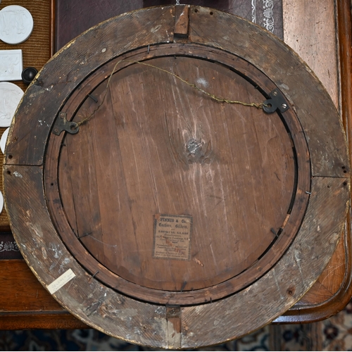 866 - An antique gilt and gesso convex mirror, 36 cm dia.