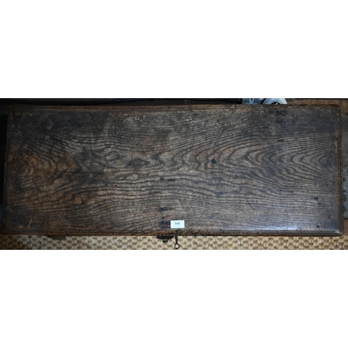 939 - A 17th century oak six plank coffer, with iron staple lock and key, the relief carved front centred ... 