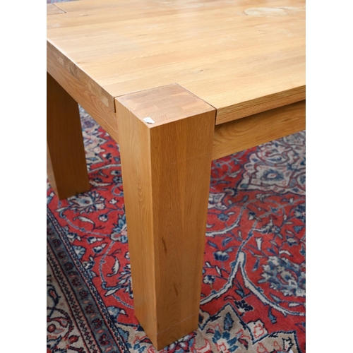 28 - A large contemporary light oak corner-leg dining table, rectangular top with square supports (remove... 