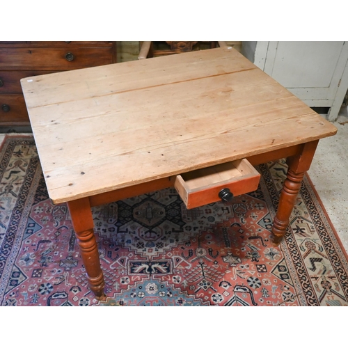 165 - A vintage pine kitchen table on turned legs, 114 x 88 x 74 cm high