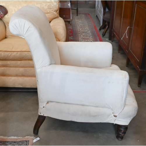 44 - An antique oak framed low armchair with turned front legs and calico fabric cover
