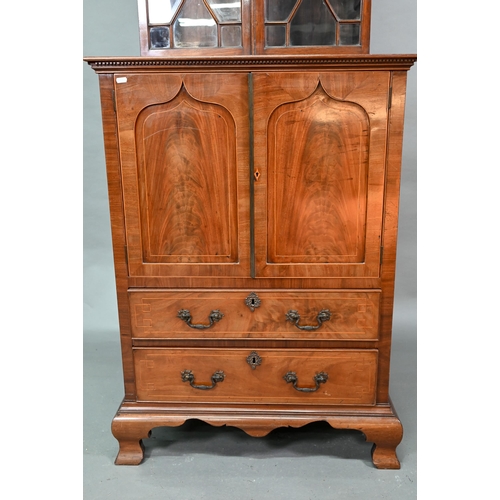 54 - # A Victorian mahogany cabinet with pair of Arabic arched panel doors over two long drawers, raised ... 