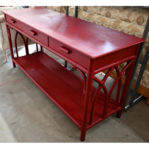 101 - A burgundy painted rattan and wicker framed sideboard with three drawers and open under-tier, 154 x ... 