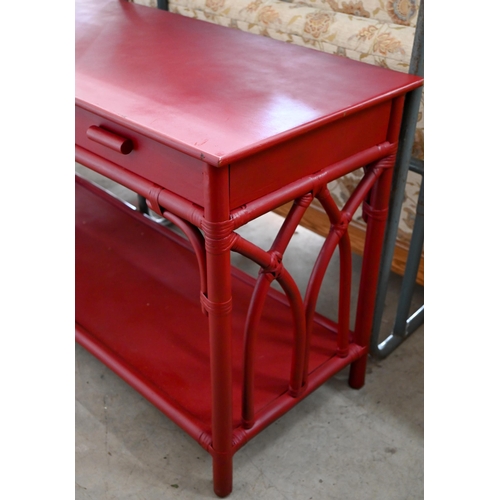 101 - A burgundy painted rattan and wicker framed sideboard with three drawers and open under-tier, 154 x ... 