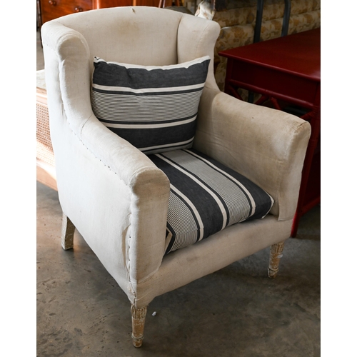 102 - A pair of calico wing-back armchairs (for re-upholstery) with blue and white striped fabric seat cus... 