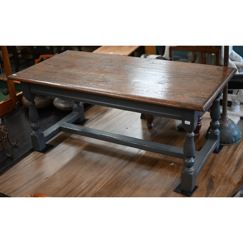 105 - A rectangular oak coffee table on slate grey painted base with baluster turned legs united by stretc... 