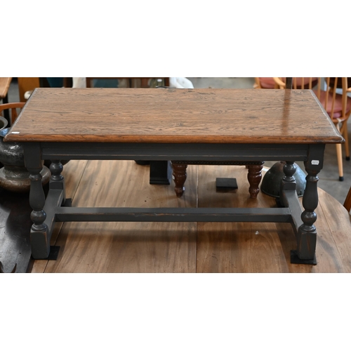 105 - A rectangular oak coffee table on slate grey painted base with baluster turned legs united by stretc... 