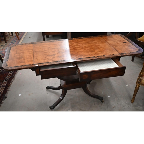 108 - A Regency mahogany and crossbanded coromandel sofa table, the drop leaf top over two frieze drawers ... 