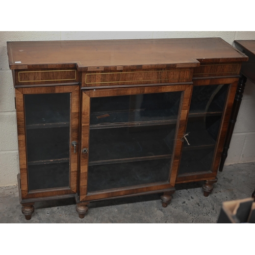 118 - A 19th century rosewood breakfront bookcase with glazed doors on short turned supports, decorative b... 