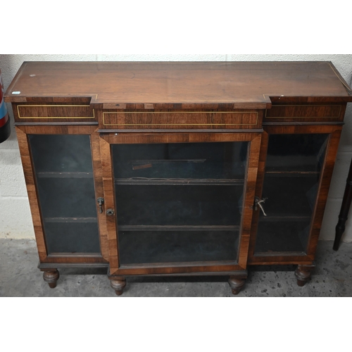 118 - A 19th century rosewood breakfront bookcase with glazed doors on short turned supports, decorative b... 