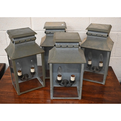 120 - A set of four Hector Finch aged metal glazed twin sconce wall lanterns 22 cm w x 16 cm d x 41 cm h