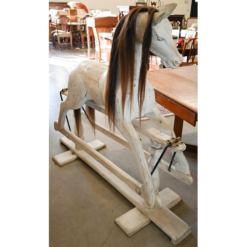 144 - A painted wooden rocking horse on swing stand with turned supports, 140 cm wide x 124 cm high