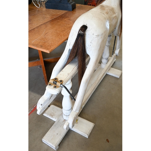 144 - A painted wooden rocking horse on swing stand with turned supports, 140 cm wide x 124 cm high