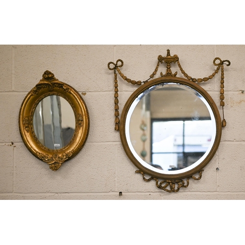 145 - A bevelled circular wall mirror in decorative neoclassical style gilt frame, 45 cm diam to/w smaller... 