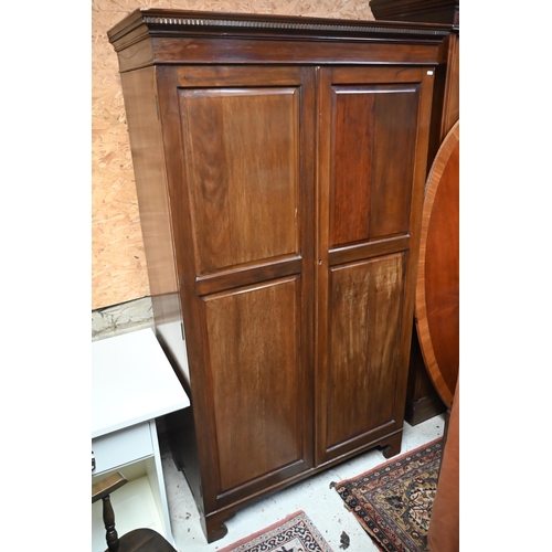 158 - An Edwardian mahogany wardrobe with full length twin-panelled doors on bracket feet, 108 cm wide x 5... 