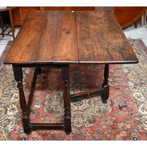 167 - An 18th century oak cottage dining table iwth single-side drop-leaf on gateleg action base, 85 x 105... 