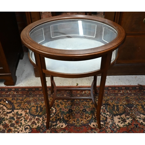 169 - An oval satin walnut glazed vitrine table, 60 cm wide x 45 cm deep x 72 cm high