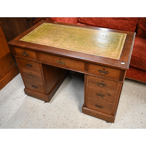 173 - An Edwardian mahogany twin-pedestal desk with gilt-tooled green leather top and nine drawers a/f, 10... 