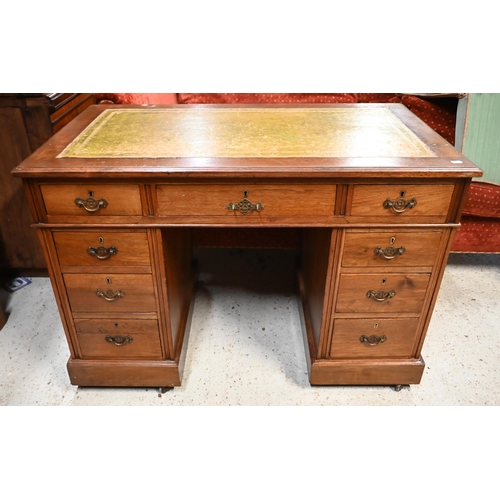 173 - An Edwardian mahogany twin-pedestal desk with gilt-tooled green leather top and nine drawers a/f, 10... 