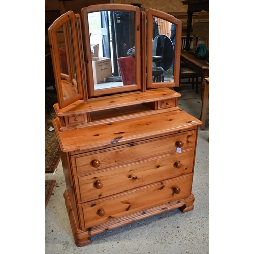 176 - # A stained pine mirror backed dressing chest to/w pine chest of four long drawers (2)