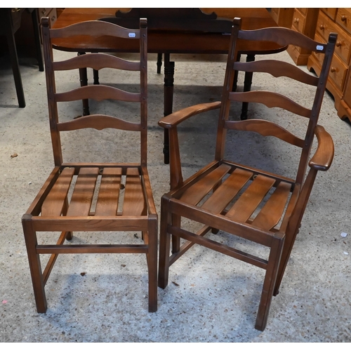 183 - An Ercol elm draw leaf dining table, on shaped trestle ends united by a mid-height centre stretcher,... 