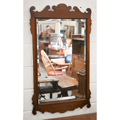 21 - A 19th century bevelled wall mirror in fret-cut walnut frame, 65 cm wide x 114 cm high
