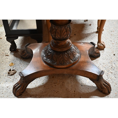 211 - A Victorian mahogany fold over tea table, raised on an acanthus carved support to a platform base, o... 