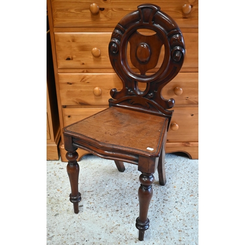 214 - A Victorian mahogany moulded back hall chair