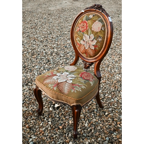 223 - A Victorian walnut framed bead and tapestry upholstered chair