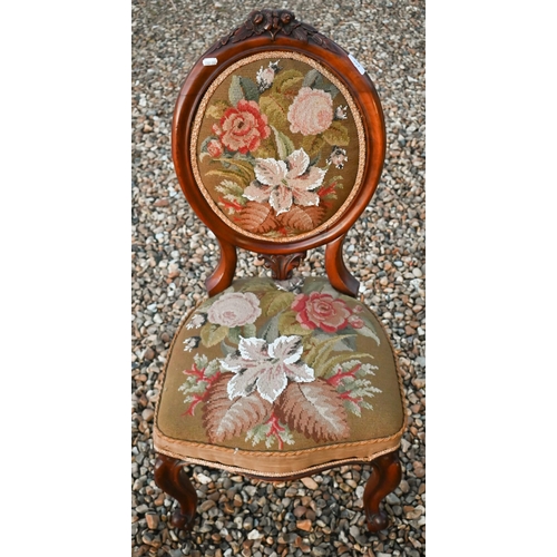 223 - A Victorian walnut framed bead and tapestry upholstered chair