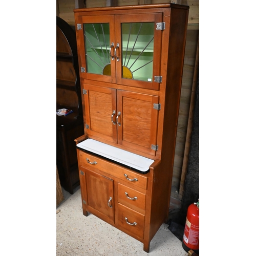 230 - A vintage 1930s American 'Hoosier' kitchen cabinet, with part lead and coloured glass panelled doors... 