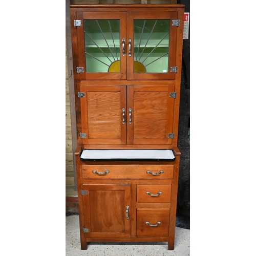 230 - A vintage 1930s American 'Hoosier' kitchen cabinet, with part lead and coloured glass panelled doors... 