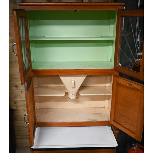 230 - A vintage 1930s American 'Hoosier' kitchen cabinet, with part lead and coloured glass panelled doors... 