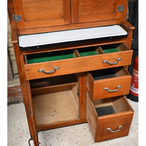 230 - A vintage 1930s American 'Hoosier' kitchen cabinet, with part lead and coloured glass panelled doors... 