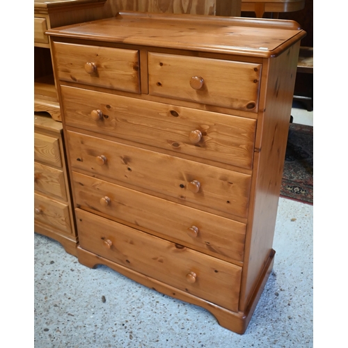 233 - A modern pine tallboy chest of two short over four long graduated drawers, on shaped bracket feet, 9... 