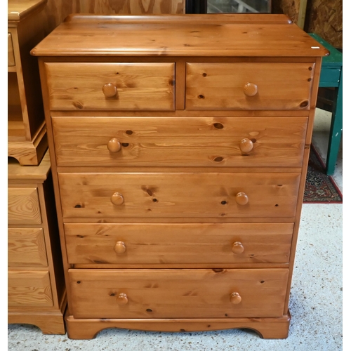 233 - A modern pine tallboy chest of two short over four long graduated drawers, on shaped bracket feet, 9... 