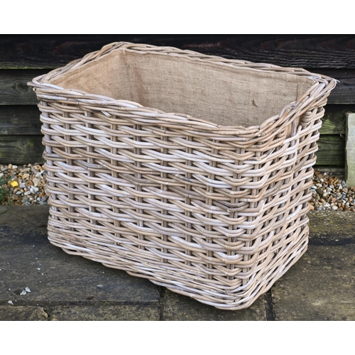 234 - A large contemporary wicker log basket, sacking lined and mounted to castors, 76 cm x 51 cm x 60 cm ... 