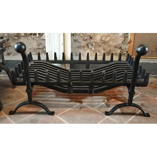 235 - A contemporary traditional cast iron fire basket and dogs to/with another weathered example in the 1... 